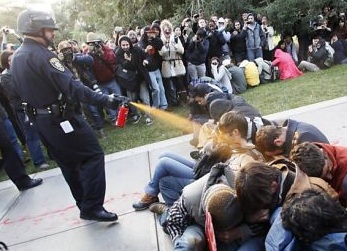 UC Davis Police Officer Lt. John Pike illegally pepper sprays peaceful student protesters at University of California Davis